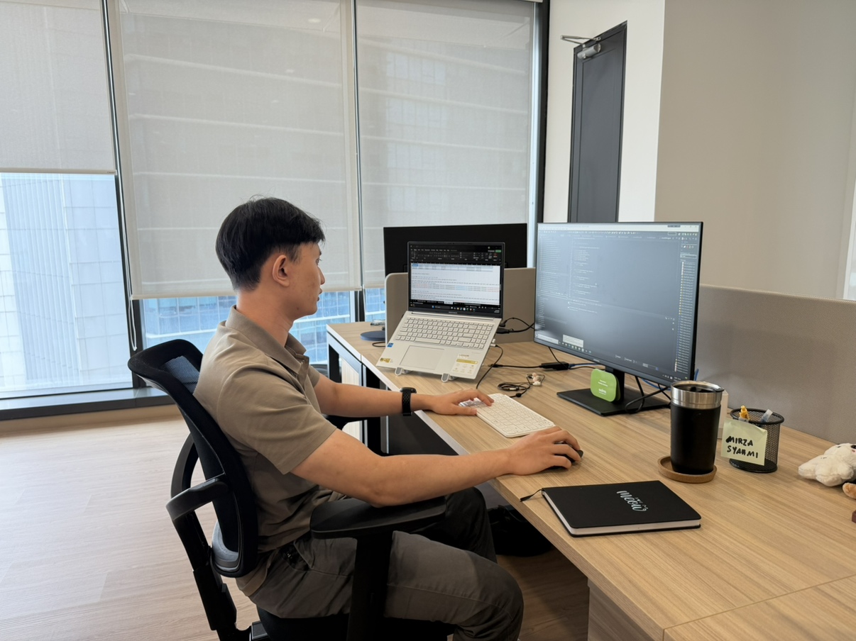 Mirza Syahmi at his workstation, Woongjin Asia Kuala Lumpur