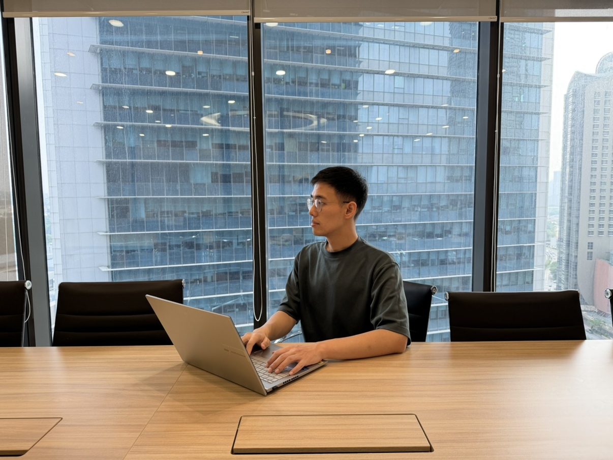Muhammad Faiz Chan in discussion and planning at Woongjin Asia office