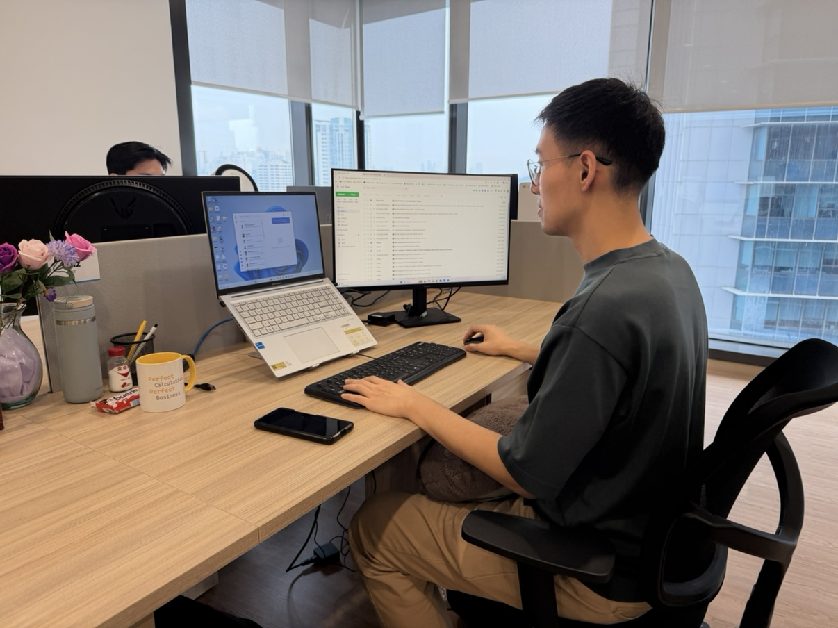 Muhammad Faiz Chan at his workstation, Woongjin Asia Kuala Lumpur